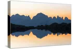 Brenta Dolomites mountains reflected in pristine water of Lago Nero di Cornisello-Roberto Moiola-Stretched Canvas
