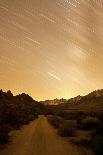 A Long Exposure Creates a Star Trail Above a Road in the Eastern Sierra Near Bishop, California-Brett Holman-Photographic Print