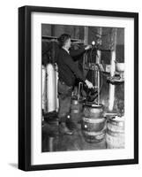 'Brewmeister' Fills Kegs at a Bootleg Brewery During Prohibition, 1933-null-Framed Photo