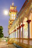 The Cao Dai temple in Vung Tau lit up at dusk with the full moon to the left of the tower, Vietnam-Brian Graney-Photographic Print