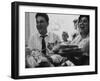 Bride and Groom Breaking Bread During Wedding-Paul Schutzer-Framed Photographic Print