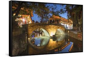 Bridge at dusk, Lijiang (UNESCO World Heritage Site), Yunnan, China-Ian Trower-Framed Stretched Canvas