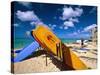 Bright Colored Surfboards on Waikiki Beach-George Oze-Stretched Canvas