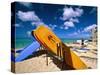 Bright Colored Surfboards on Waikiki Beach-George Oze-Stretched Canvas