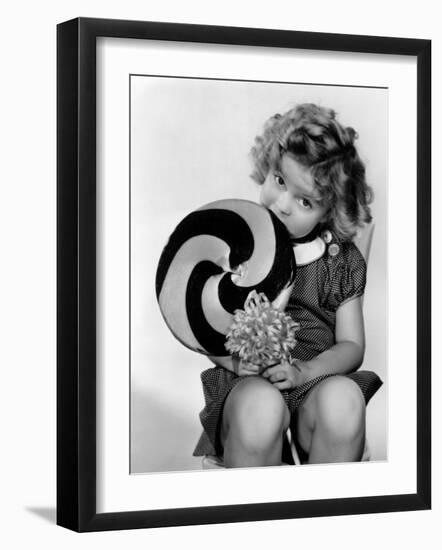 Bright Eyes, Shirley Temple Eating a Big Lollipop, 1934-null-Framed Photo