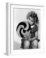 Bright Eyes, Shirley Temple Eating a Big Lollipop, 1934-null-Framed Photo