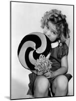 Bright Eyes, Shirley Temple Eating a Big Lollipop, 1934-null-Mounted Photo