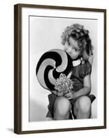 Bright Eyes, Shirley Temple Eating a Big Lollipop, 1934-null-Framed Photo