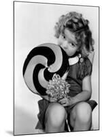 Bright Eyes, Shirley Temple Eating a Big Lollipop, 1934-null-Mounted Photo