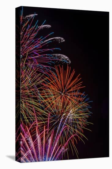 Bright Fireworks in the Sky on Black Background Vertical Image-mbolina-Stretched Canvas