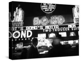 Bright Neon Lights of Bond's Clothing Store-Lisa Larsen-Stretched Canvas