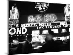 Bright Neon Lights of Bond's Clothing Store-Lisa Larsen-Mounted Photographic Print