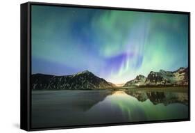 Bright night sky with Aurora Borealis (Northern Lights) over mountains and Skagsanden beach-Roberto Moiola-Framed Stretched Canvas