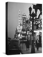 Brightly Lit Casinos Lining the Street-Peter Stackpole-Stretched Canvas