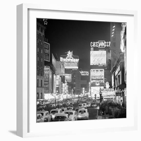 Brightly Lit Signs Shining over Traffic Going Down Broadway Towards Times Square-Andreas Feininger-Framed Photographic Print