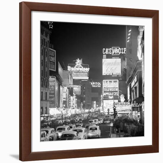 Brightly Lit Signs Shining over Traffic Going Down Broadway Towards Times Square-Andreas Feininger-Framed Photographic Print