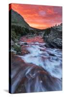 Brilliant Sunrise Sky over Swiftcurrent Falls in Glacier National Park, Montana, Usa-Chuck Haney-Stretched Canvas