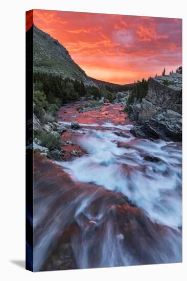 Brilliant Sunrise Sky over Swiftcurrent Falls in Glacier National Park, Montana, Usa-Chuck Haney-Stretched Canvas