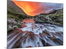Brilliant Sunrise Sky over Swiftcurrent Falls in Glacier National Park, Montana, Usa-Chuck Haney-Mounted Photographic Print