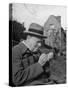 Britain's Prime Minister Winston Churchill Lighting a Cigar-null-Stretched Canvas