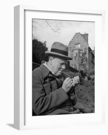 Britain's Prime Minister Winston Churchill Lighting a Cigar-null-Framed Premium Photographic Print