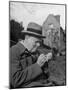 Britain's Prime Minister Winston Churchill Lighting a Cigar-null-Mounted Premium Photographic Print