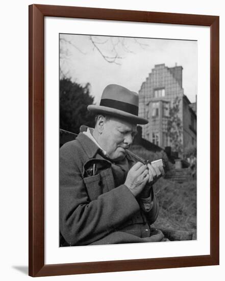 Britain's Prime Minister Winston Churchill Lighting a Cigar-null-Framed Photographic Print
