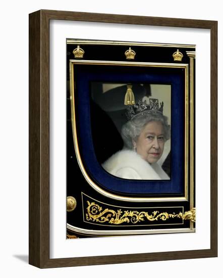 Britain's Queen Elizabeth II Arrives Back at Buckingham Palace in Her State Coach-null-Framed Photographic Print