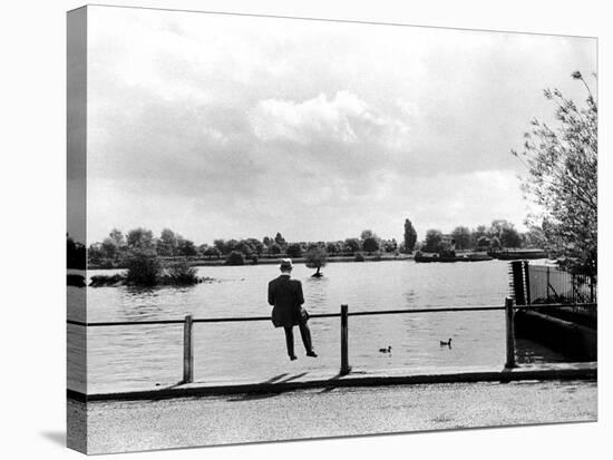 British Actor Alec Guinness Sitting Alone by Lake in a Park-Cornell Capa-Stretched Canvas