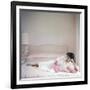 British actress Joan Collins in a pink bedroom with a pink toy poodle (photo)-null-Framed Photo