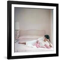 British actress Joan Collins in a pink bedroom with a pink toy poodle (photo)-null-Framed Photo