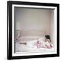 British actress Joan Collins in a pink bedroom with a pink toy poodle (photo)-null-Framed Photo