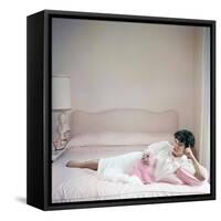 British actress Joan Collins in a pink bedroom with a pink toy poodle (photo)-null-Framed Stretched Canvas