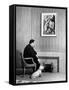 British Born Film Director Posing Beside Fireplace at Home with Pet Sealyham Terrier, Mr. Jenkins-Peter Stackpole-Framed Stretched Canvas