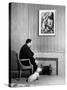 British Born Film Director Posing Beside Fireplace at Home with Pet Sealyham Terrier, Mr. Jenkins-Peter Stackpole-Stretched Canvas