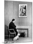 British Born Film Director Posing Beside Fireplace at Home with Pet Sealyham Terrier, Mr. Jenkins-Peter Stackpole-Mounted Premium Photographic Print