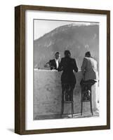 British Couple on High Stools at Ice Bar Outdoors at Grand Hotel as Waiter Pours Them Drinks-Alfred Eisenstaedt-Framed Photographic Print