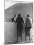 British Couple on High Stools at Ice Bar Outdoors at Grand Hotel as Waiter Pours Them Drinks-Alfred Eisenstaedt-Mounted Photographic Print