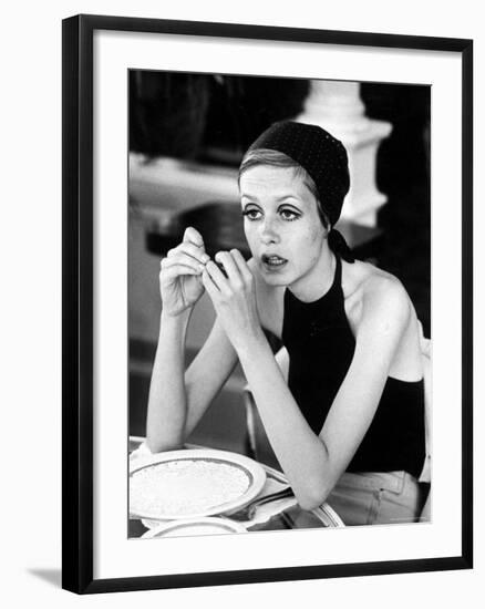 British Fashion Model Twiggy with Slumpy Posture, at Table in Restaurant at Disneyland-Ralph Crane-Framed Premium Photographic Print