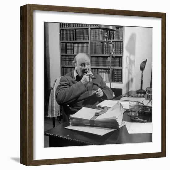 British Leader Winston Churchill Smoking a Cigar at His Desk-Nat Farbman-Framed Premium Photographic Print