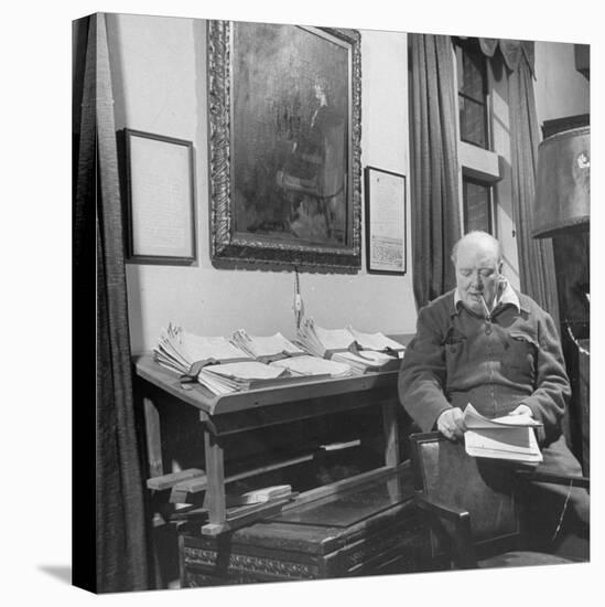British Leader Winston Churchill Working in His Office, with Painting of Wife Hanging on the Wall-null-Stretched Canvas