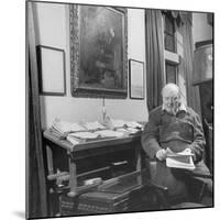British Leader Winston Churchill Working in His Office, with Painting of Wife Hanging on the Wall-null-Mounted Photographic Print