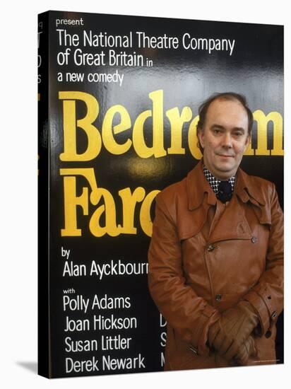 British Playwright Alan Ayckbourn Standing Before Broadway Poster of His Comedy "Bedroom Farce."-Ted Thai-Stretched Canvas