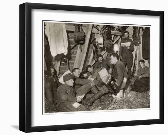 British Soldiers off Duty Smoking and Listening to an Accordion at the Front Somewhere in Flanders-null-Framed Art Print