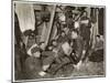 British Soldiers off Duty Smoking and Listening to an Accordion at the Front Somewhere in Flanders-null-Mounted Art Print