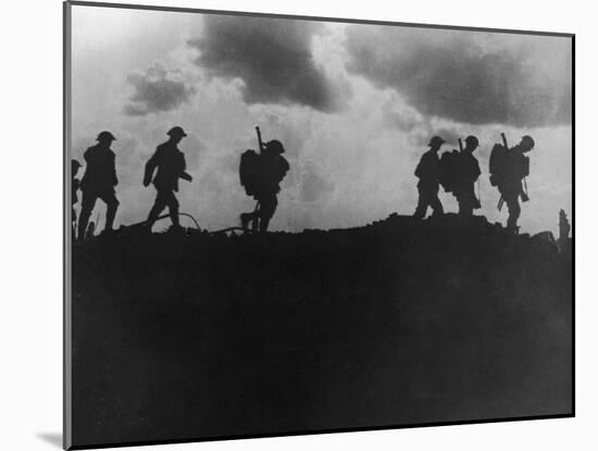 British Soldiers Silhouetted Along a Ridge During the World War I Battle of Mons-null-Mounted Photographic Print