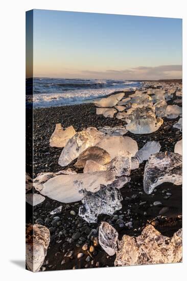 Broken Ice from Washed Upiicebergs on Jokulsarlon Black Beach at Sunrise-Neale Clark-Stretched Canvas