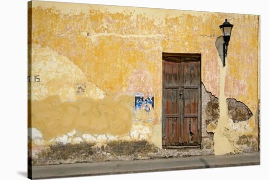 Broken Plaster on Yellow Wall with Old Wood Door-Thom Lang-Stretched Canvas