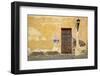 Broken Plaster on Yellow Wall with Old Wood Door-Thom Lang-Framed Photographic Print