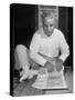 Broker Astrologer Reading Horoscope While Trading at Bombay Stock Exchange-Margaret Bourke-White-Stretched Canvas